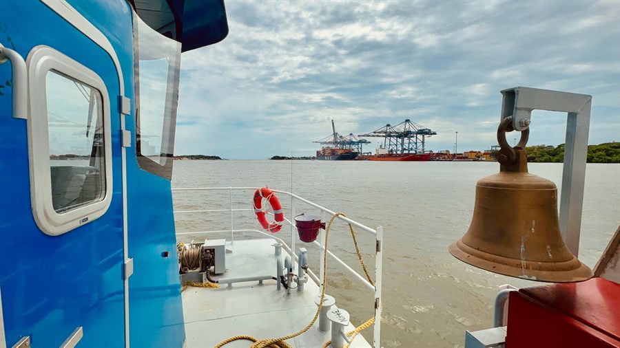 Brass bell on the deck of a boat in the port of Cochin, India